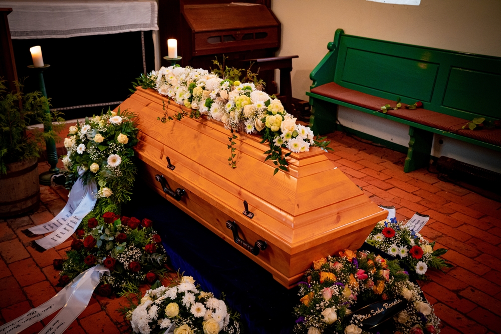 Floral,decoration,on,a,coffin,while,funeral,service